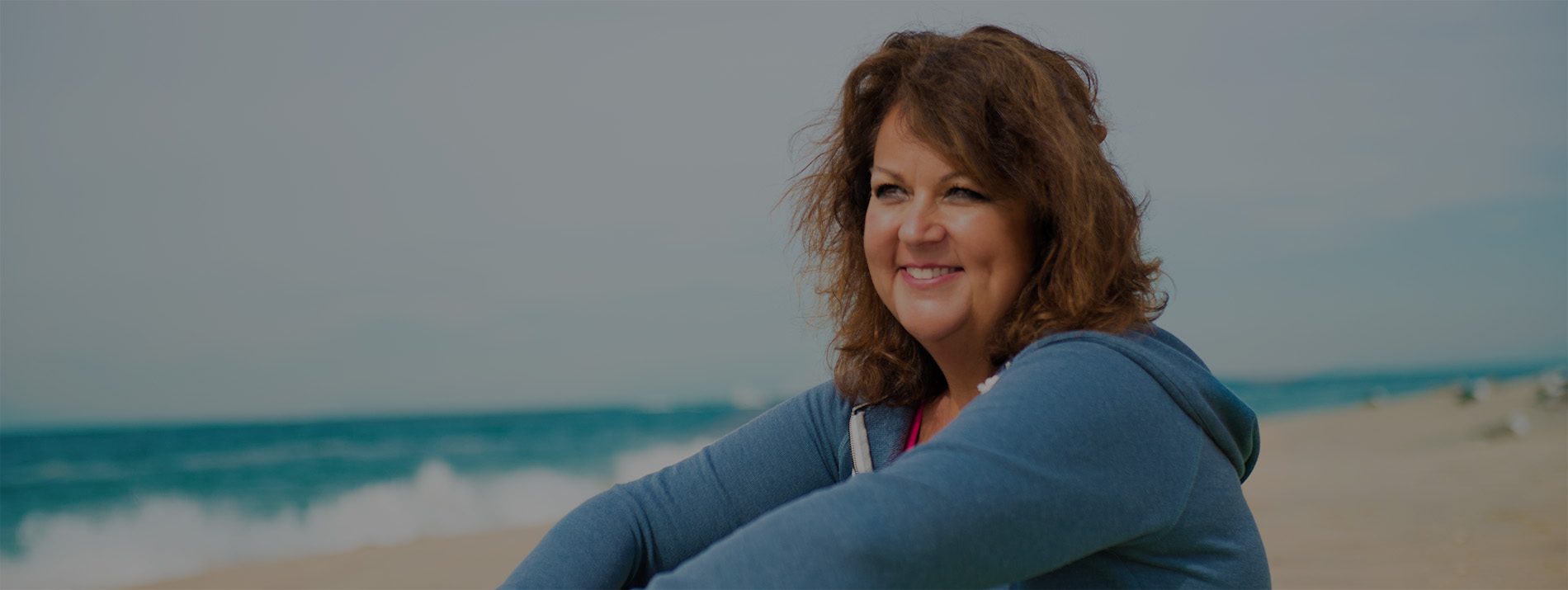 woman sitting on beach