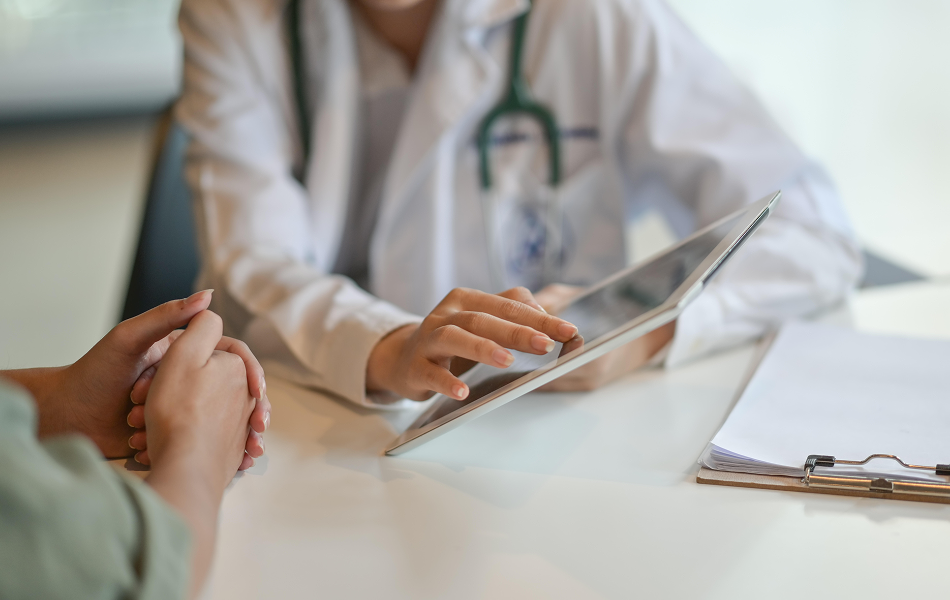 Doctor showing a patient some information