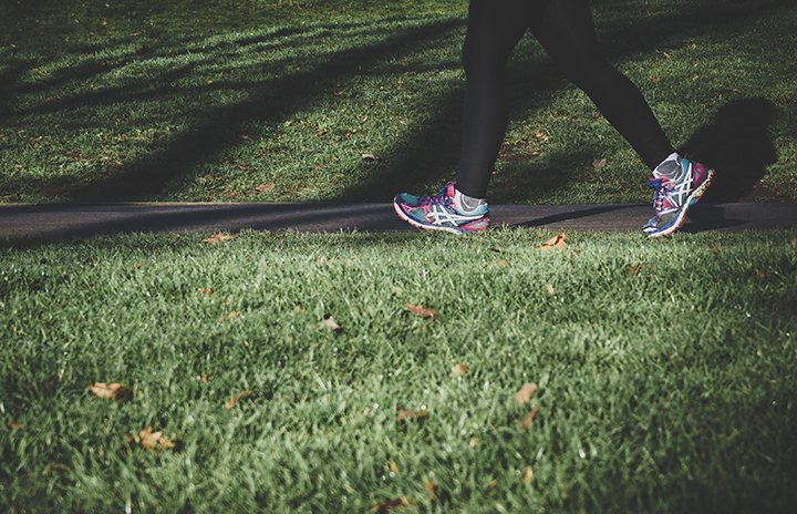 A cutout of a woman's legs running in the night.